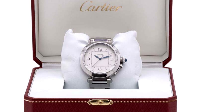 Cartier Pasha automatic oversize 42mm case with wide smooth bezel, sapphire crystal, antique silver/parchment dial with blued steel kite shaped hands and oversize sweep seconds. With cabochon sapphire capped screw down canteen style crown. In minty condition complete with box and papers.